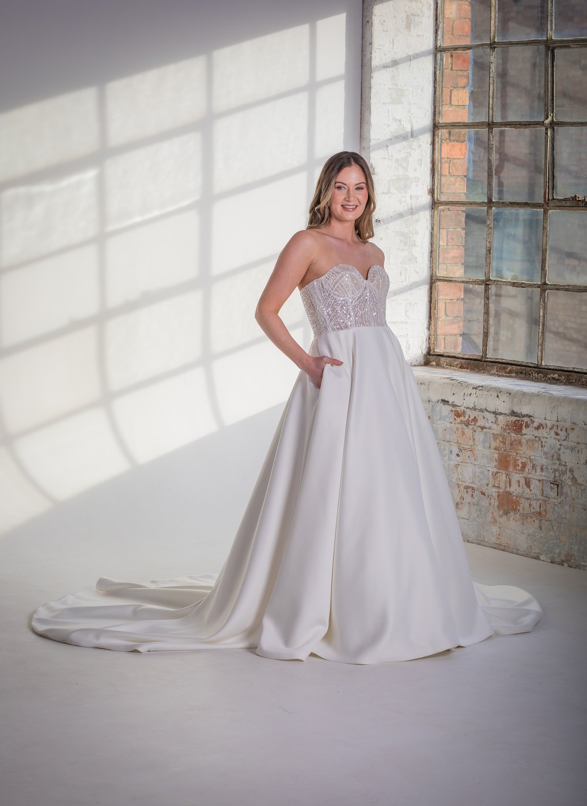 Bride wearing a structured wedding dress with a full skirt